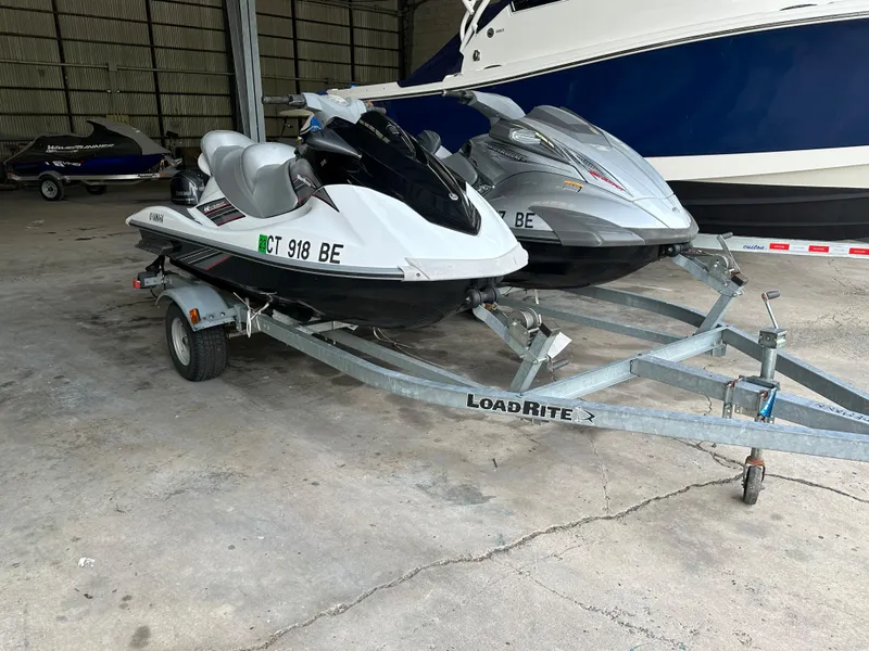 Slide: The Image of 2009 Yamaha WaveRunner FX Cruiser H/O jet skis on LoadRite trailer in storage. - 4