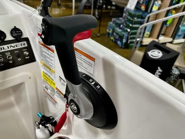 Slide: The Image of 2024 Bayliner Element M15 boat throttle control and dashboard. - 10