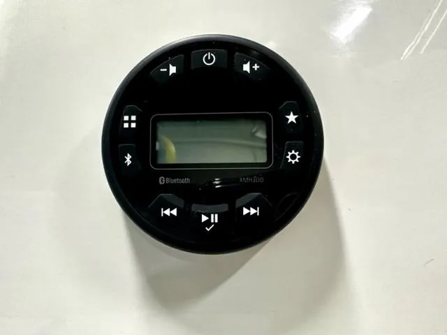 Slide: The Image of 2024 Bayliner Element M15 boat stereo system with Bluetooth and control buttons. - 12