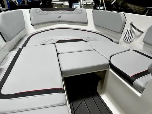 Slide: The Image of 2024 Bayliner Element M15 boat interior with cushioned seating and speaker. - 13