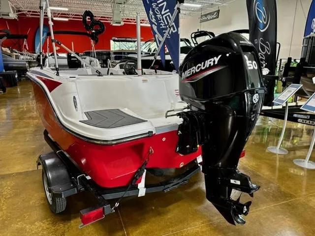 Slide: The Image of 2024 Bayliner Element M15 boat with Mercury 50 outboard motor in showroom. - 3