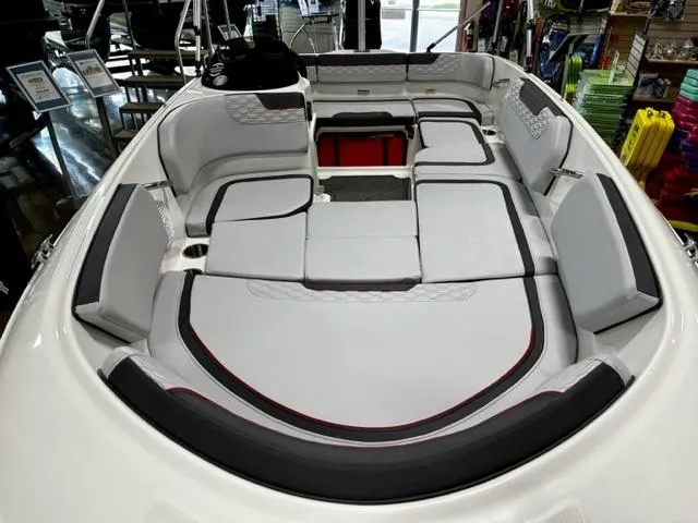 Slide: The Image of 2024 Bayliner Element M15 boat interior with cushioned seating and storage compartments. - 6