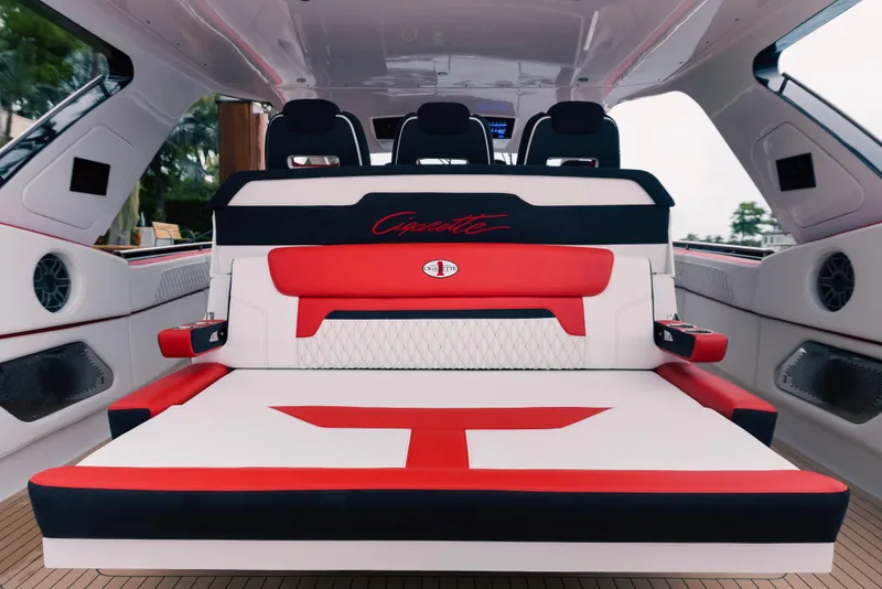 Slide: The Image of 2024 Cigarette 52 Thunder luxury boat interior with red and white seating. - 10