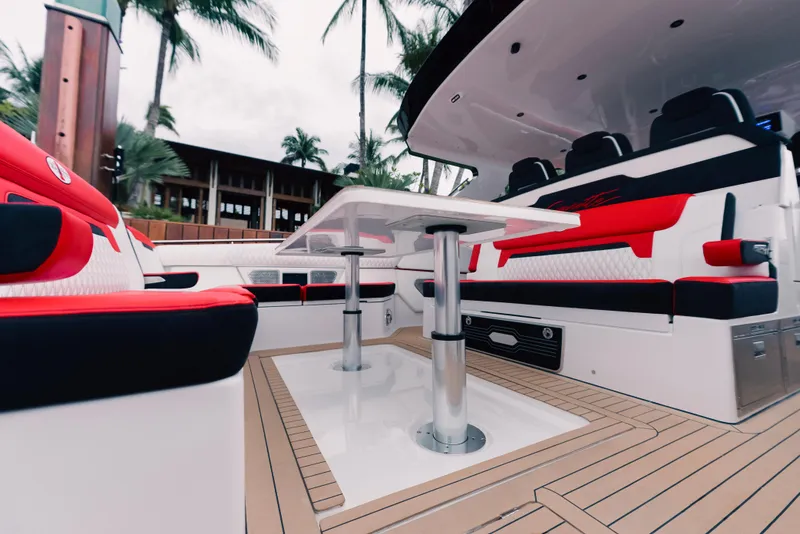 Slide: The Image of 2024 Cigarette 52 Thunder boat interior with red and black seating, modern design. - 11