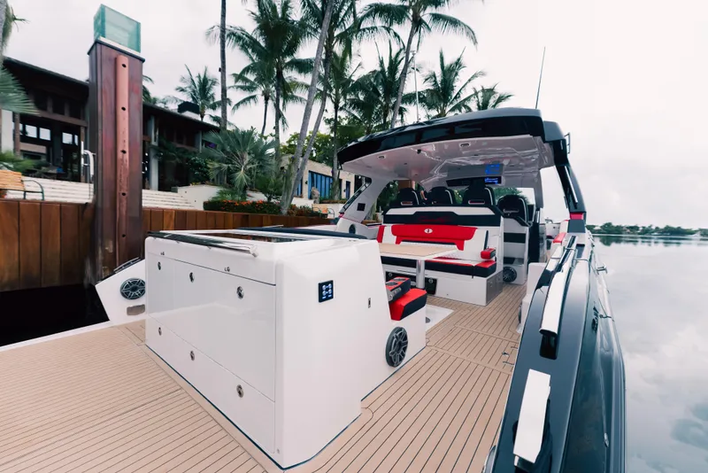 Slide: The Image of 2024 Cigarette 52 Thunder luxury boat with modern seating and sleek design. - 12