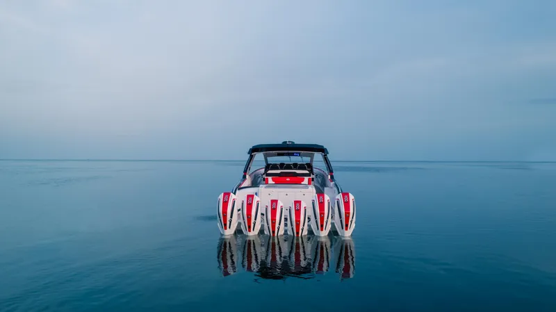 Slide: The Image of 2024 Cigarette 52 Thunder boat on calm water, rear view. - 3