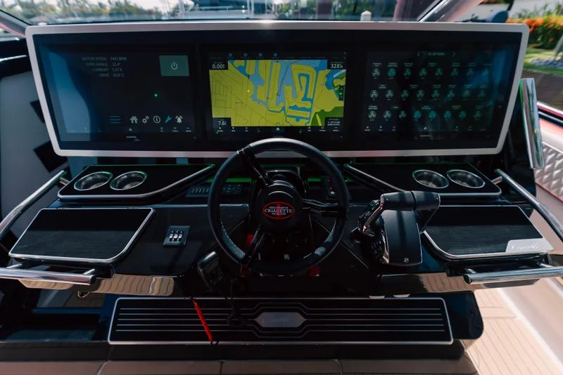 Slide: The Image of 2024 Cigarette 52 Thunder boat dashboard with advanced navigation and control systems. - 9