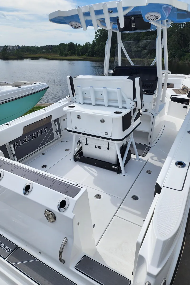 Slide: The Image of 2024 Blackfin 252 CC boat with spacious deck and modern amenities. - 11