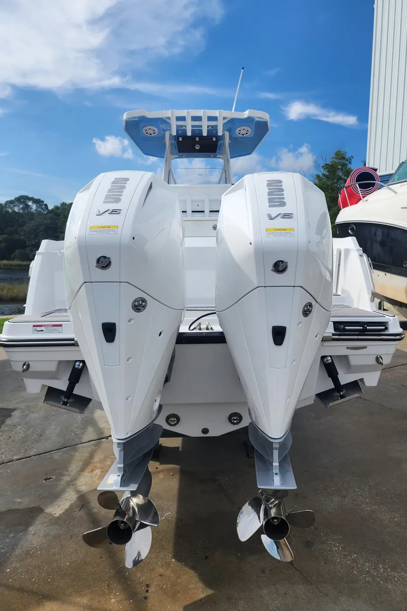Slide: The Image of 2024 Blackfin 252 CC boat with twin outboard engines. - 4