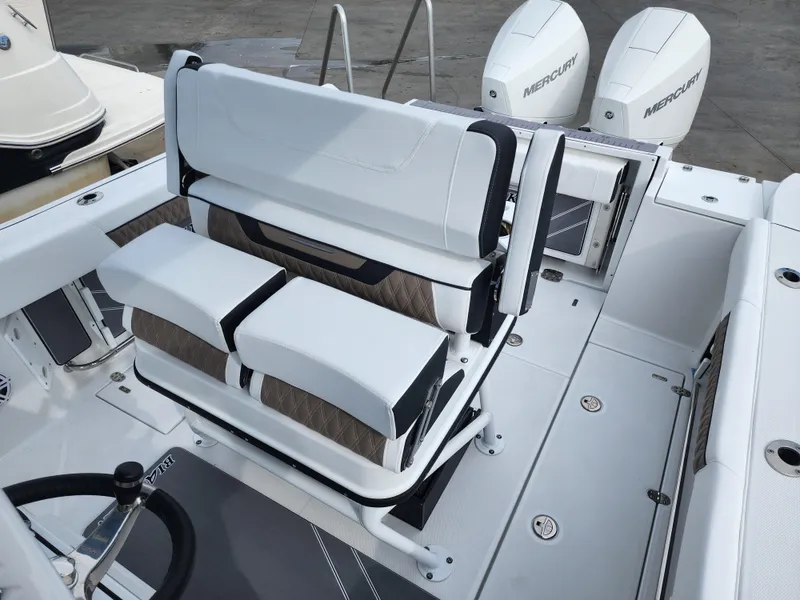 Slide: The Image of 2024 Blackfin 252 CC boat interior with dual Mercury engines. - 7