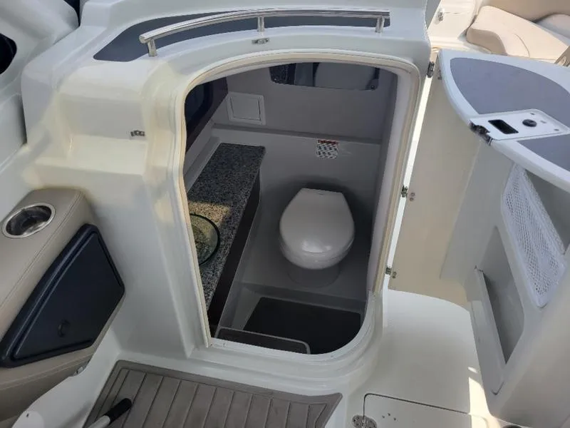 Slide: The Image of 2024 Finseeker 260 DC boat interior with compact bathroom and toilet. - 15