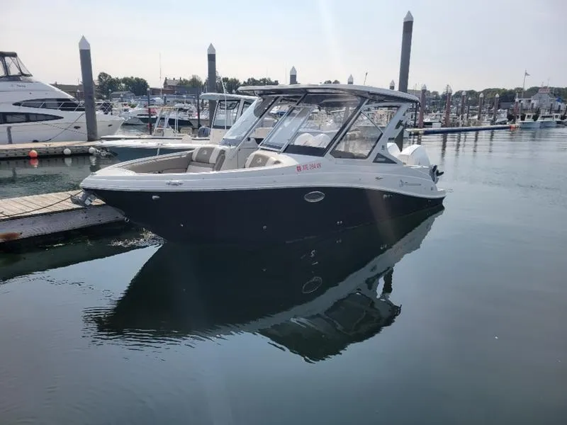 Slide: The Image of 2024 Finseeker 260 DC boat docked in a marina. - 5