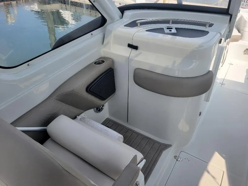 Slide: The Image of 2024 Finseeker 260 DC boat interior with seating and storage. - 6