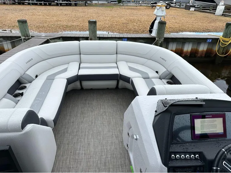 Slide: The Image of 2023 Viaggio D 23 Q pontoon boat with spacious seating and modern dashboard. - 3