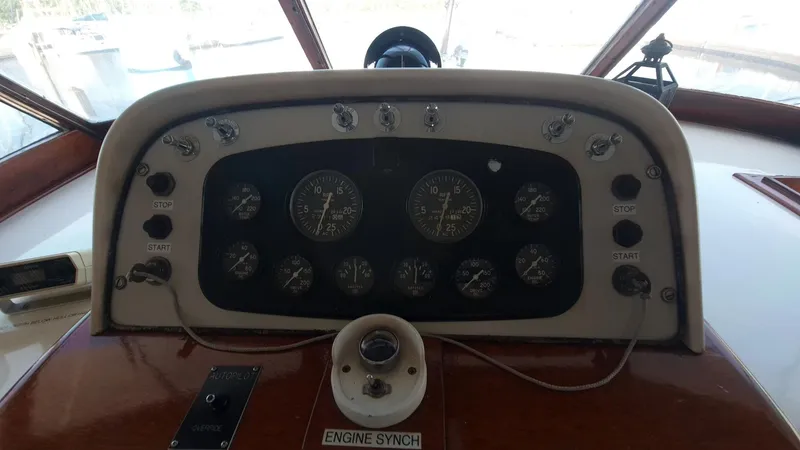 Slide: The Image of 1965 Chris-Craft 56 Roamer boat dashboard with gauges and controls. - 21