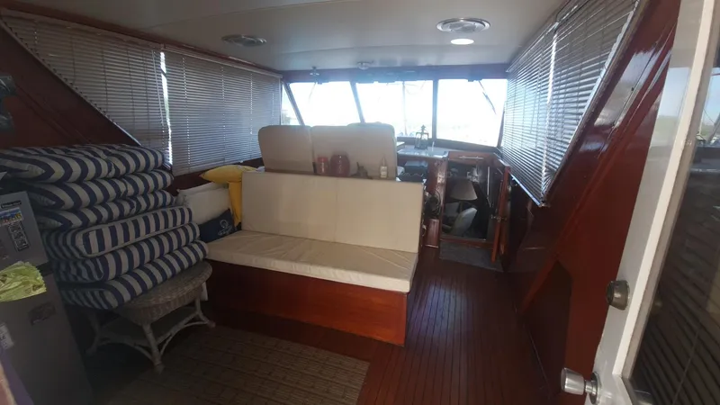 Slide: The Image of Interior of 1965 Chris-Craft 56 Roamer yacht with seating and helm station. - 5