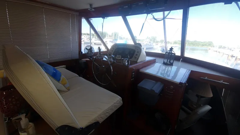 Slide: The Image of Interior helm of 1965 Chris-Craft 56 Roamer yacht with steering wheel and navigation equipment. - 6