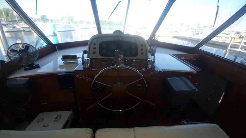Slide: The Image of Helm of 1965 Chris-Craft 56 Roamer yacht with classic wooden steering wheel. - 7
