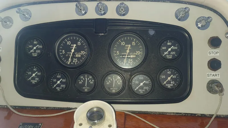 Slide: The Image of 1965 Chris-Craft 56 Roamer dashboard with gauges and controls. - 9