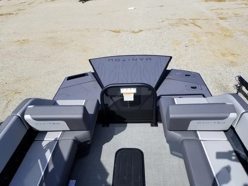 Slide: The Image of 2025 Manitou Cruise boat interior with gray seating and flooring. - 27