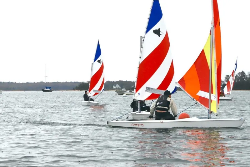 Slide: The Image of Sailboats on water, Dinghy Rocket Board Boat 2023 model, colorful sails, people sailing. - 4