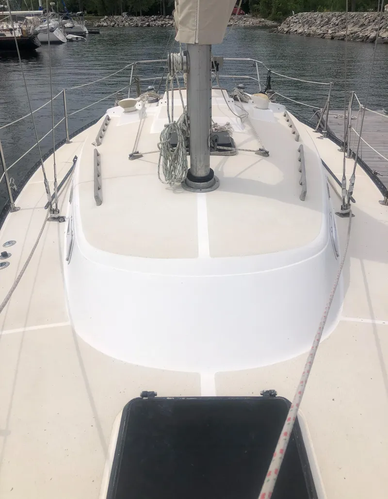 Slide: The Image of 1980 Tartan 33 sailboat deck view at marina. - 13