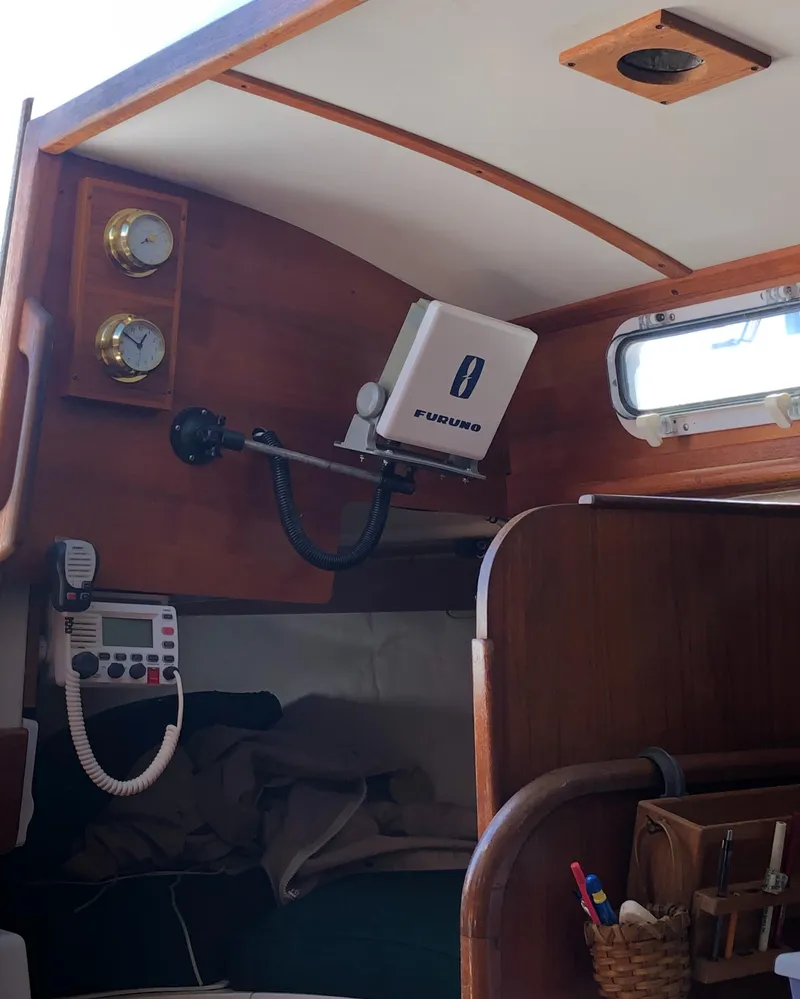 Slide: The Image of Interior of a 1980 Tartan 33 sailboat with navigation equipment and wooden finish. - 18