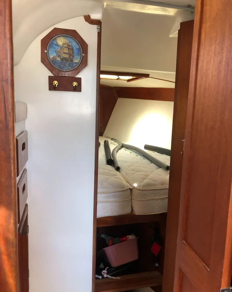 Slide: The Image of Interior of a 1980 Tartan 33 sailboat with cozy cabin and nautical decor. - 24
