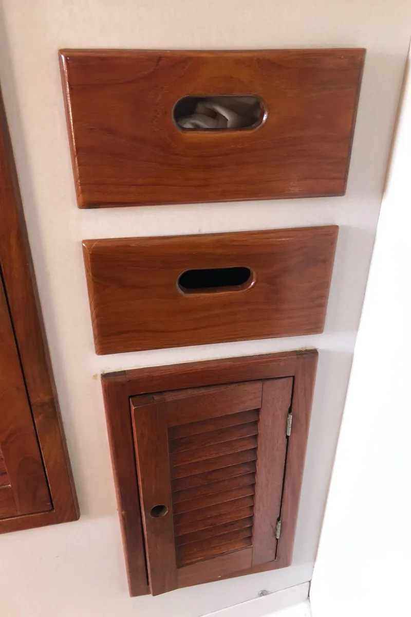 Slide: The Image of Wooden storage compartments on a 1980 Tartan 33 sailboat interior. - 29