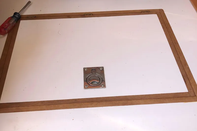 Slide: The Image of Wooden frame with metal latch on a Tartan 33, 1980 model. - 32