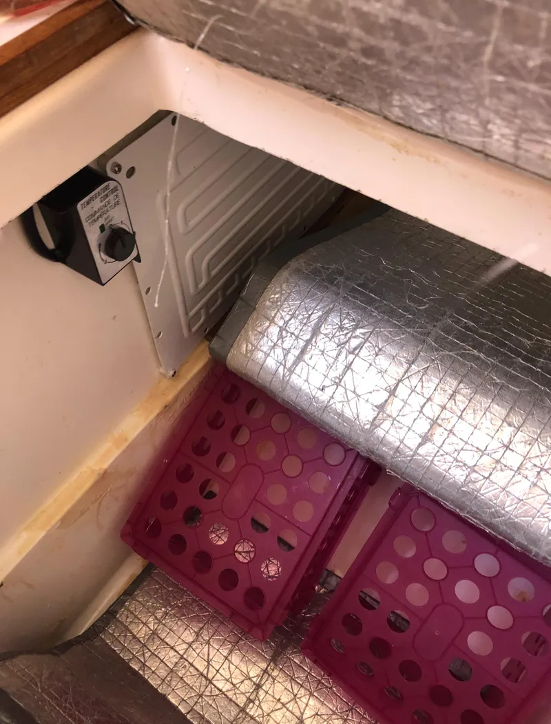 Slide: The Image of Interior of 1980 Tartan 33 sailboat with insulation and storage bins. - 33