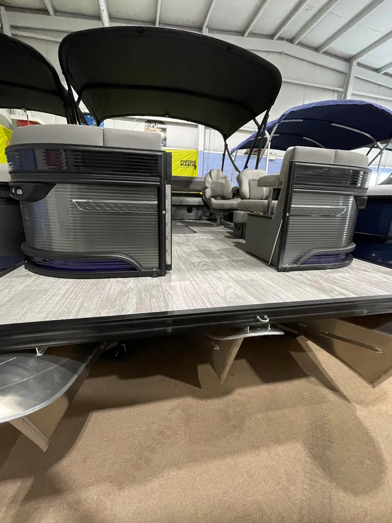 Slide: The Image of 2023 Apex Marine M 22 pontoon boat with spacious seating and canopy. - 1