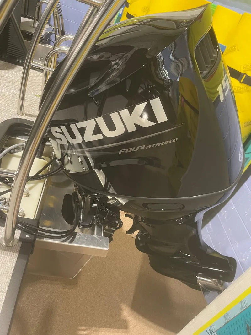 Slide: The Image of 2023 Apex Marine M 22 with Suzuki 15 HP four-stroke outboard motor. - 10