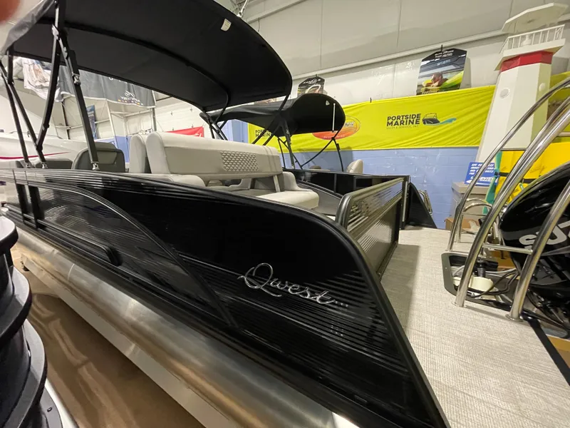 Slide: The Image of 2023 Apex Marine M 22 pontoon boat on display indoors. - 2