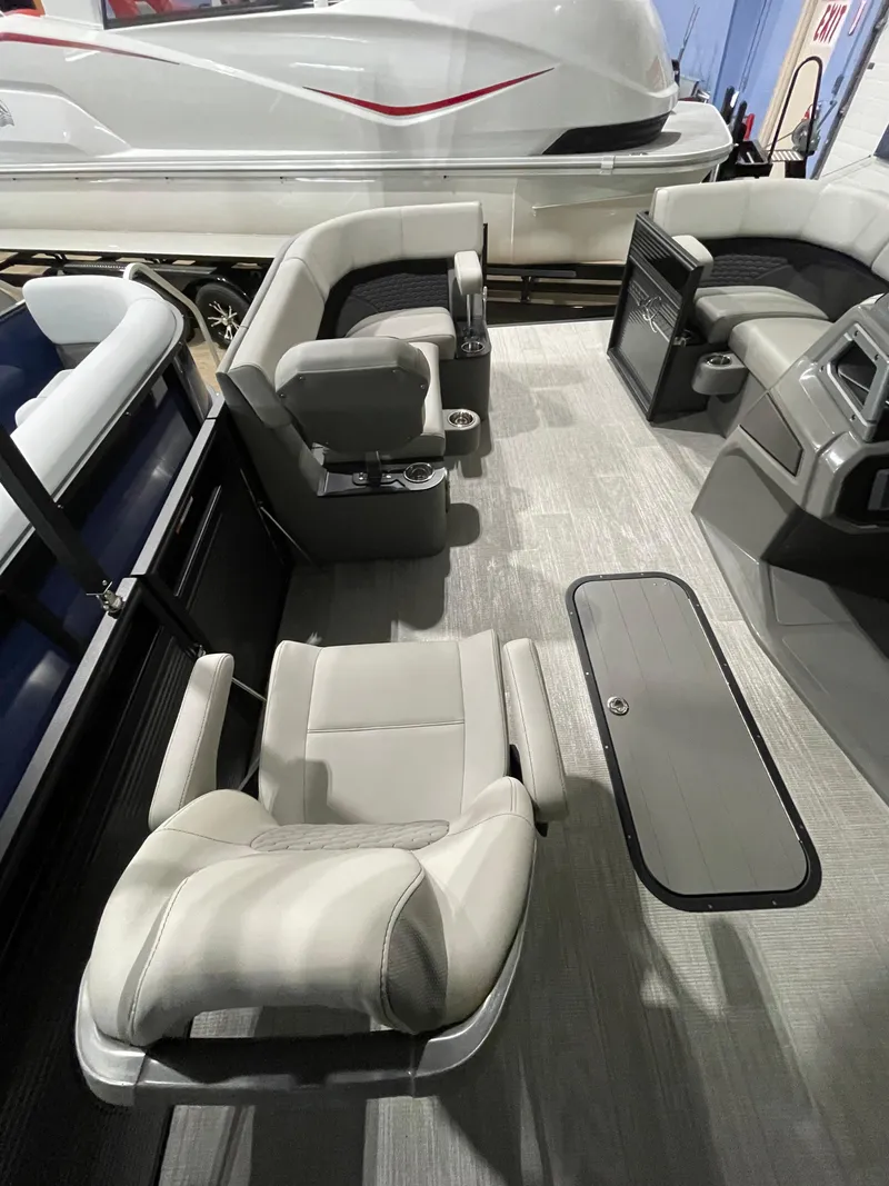 Slide: The Image of 2023 Apex Marine M 22 boat interior with modern seating and sleek design. - 5