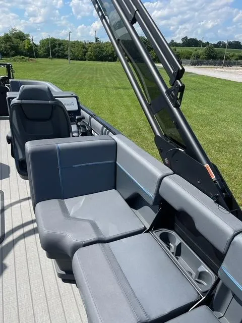 Slide: The Image of 2023 Manitou 24 Explore SB pontoon boat interior with 250 hp Mercury engine. - 5