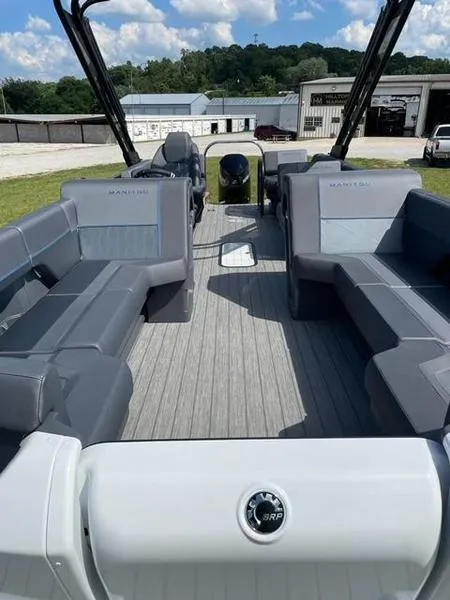 Slide: The Image of 2023 Manitou 24 Explore SB pontoon boat with 250 hp Mercury engine, spacious seating. - 7