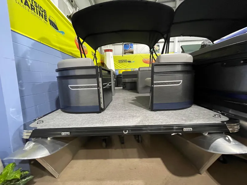 The Image of 2023 Apex Marine E 818 pontoon boat interior at a showroom. - 0