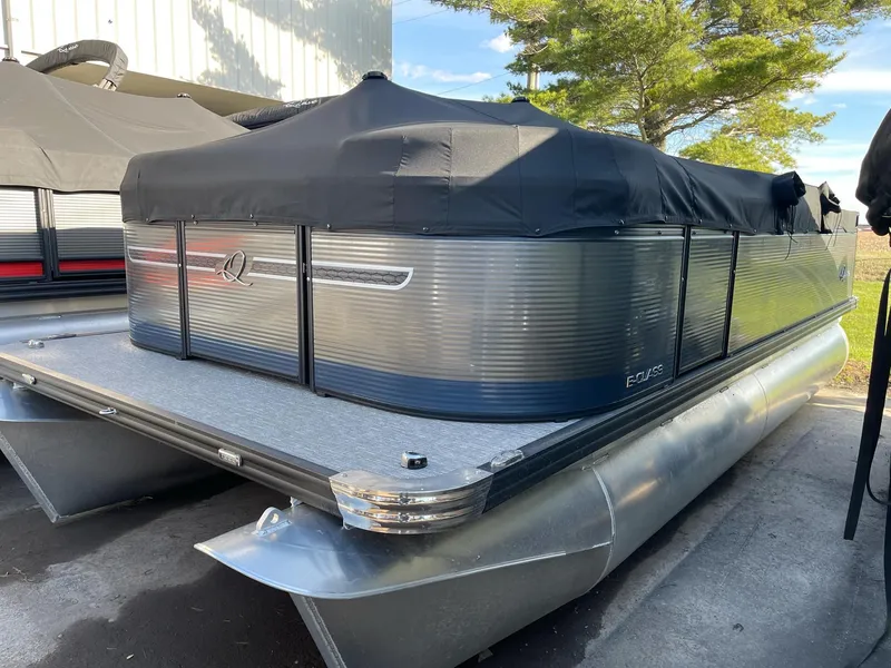 Slide: The Image of 2023 Apex Marine E 818 pontoon boat with cover, docked outdoors. - 10