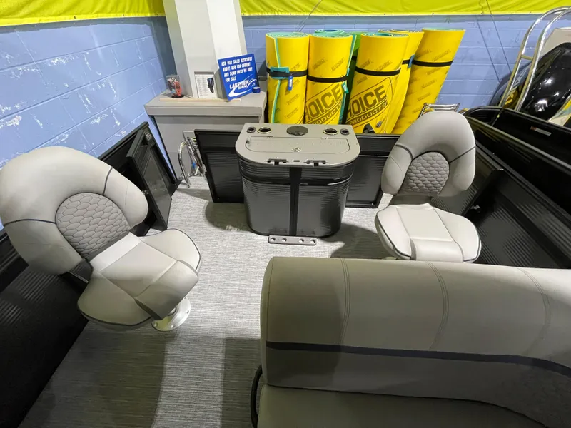 Slide: The Image of 2023 Apex Marine E 818 boat interior with gray seating and storage compartments. - 5