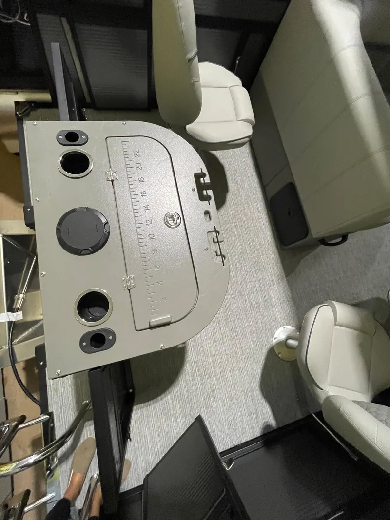 Slide: The Image of 2023 Apex Marine E 818 boat interior with seating and control panel. - 7