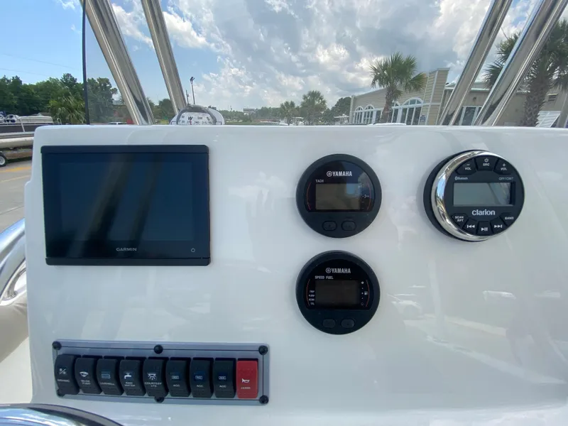 Slide: The Image of Dashboard of 2024 Key West 203 FS boat with Garmin display and Yamaha gauges. - 12