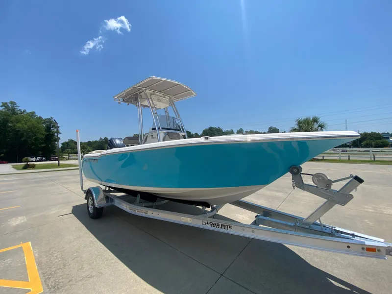 Slide: The Image of 2024 Key West 203 FS boat on trailer under clear blue sky. - 2
