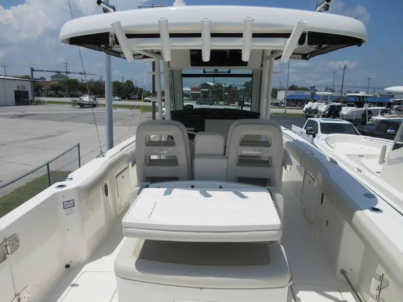 Slide: The Image of 2023 Boston Whaler 33 OUTRAGE boat interior with seating and console. - 2