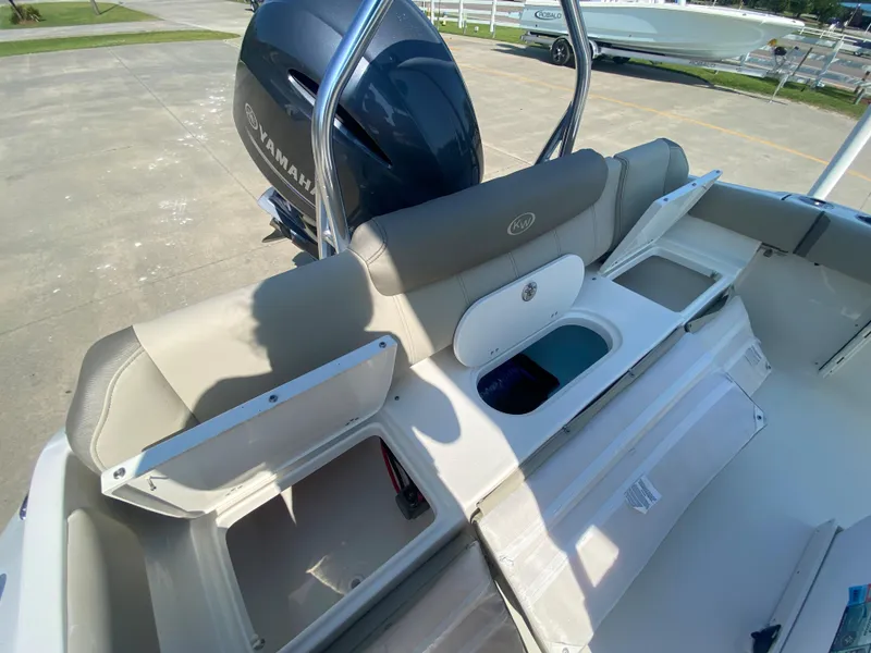 Slide: The Image of 2024 Key West 219 FS boat interior with storage compartments and Yamaha outboard motor. - 10