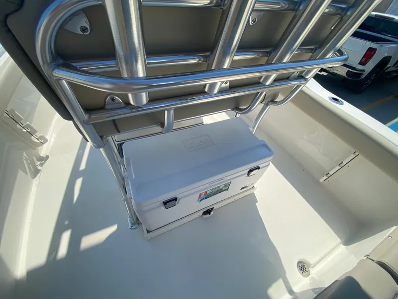 Slide: The Image of 2024 Key West 219 FS boat interior with cooler and seating. - 11