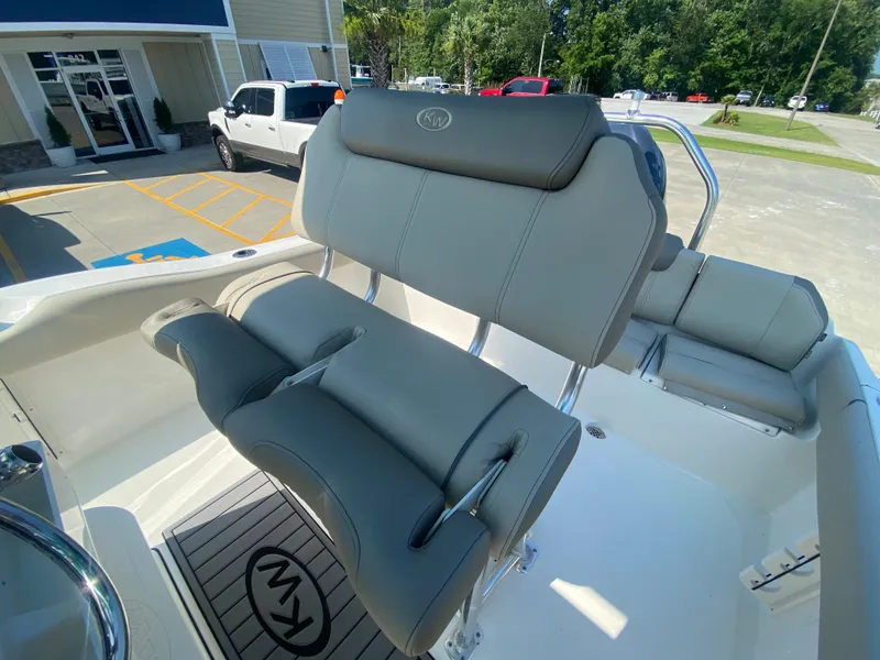 Slide: The Image of 2024 Key West 219 FS boat interior with gray seating and KW logo. - 13