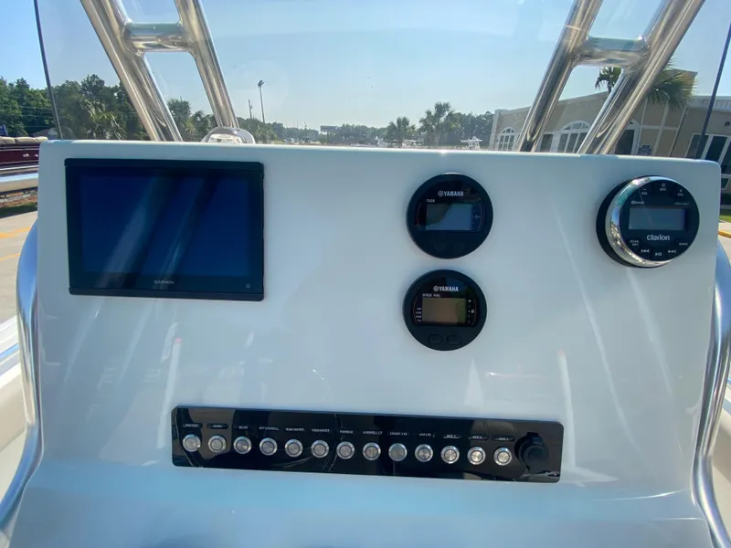 Slide: The Image of 2024 Key West 219 FS boat dashboard with modern controls and display. - 14