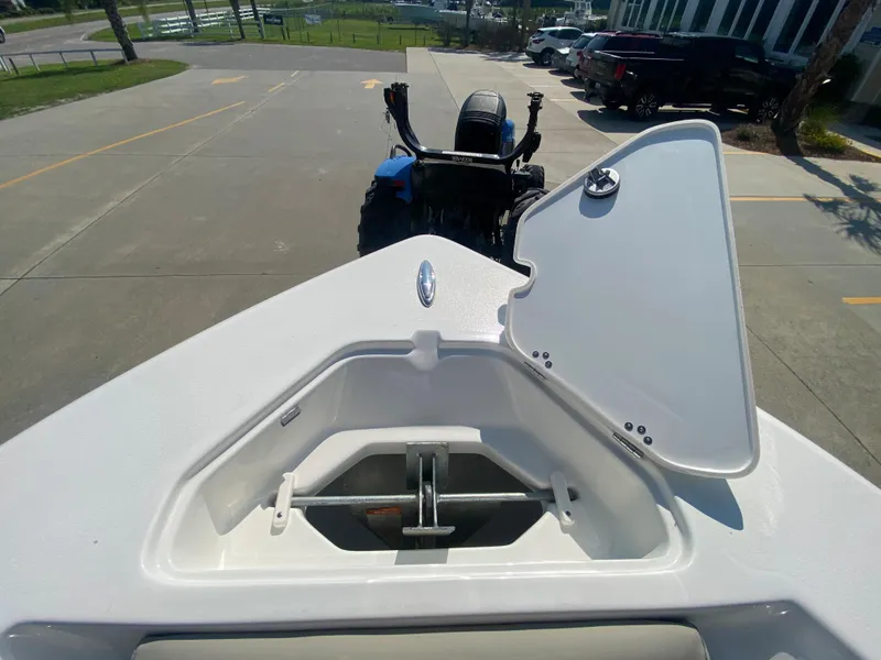 Slide: The Image of 2024 Key West 219 FS boat with open anchor storage compartment. - 21