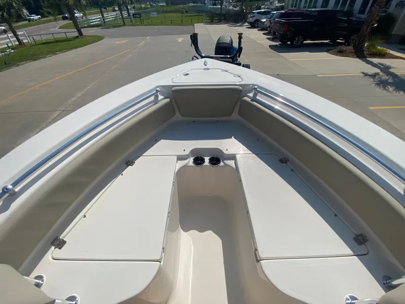 Slide: The Image of 2024 Key West 219 FS boat bow area with seating and storage compartments. - 22